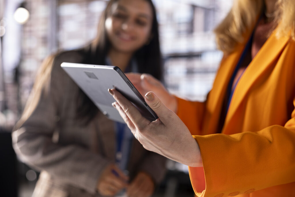 A woman using a mobile phone to access a safety app that tracks her location & sends alerts| safety advice for women